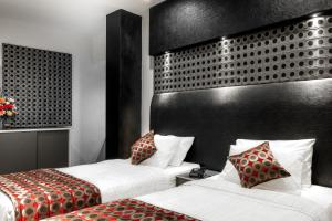 Postel nebo postele na pokoji v ubytování Saaral Residency