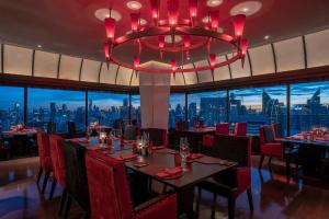 A restaurant or other place to eat at The Landmark Bangkok - SHA Extra Plus