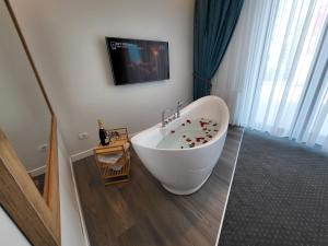 TV a/nebo společenská místnost v ubytování Hotel Excellence
