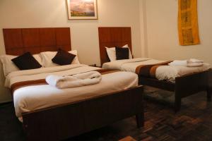Letto o letti in una camera di Hotel ThorongLa Thamel