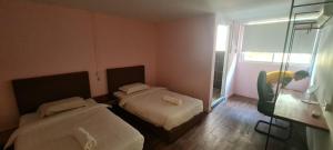 Postel nebo postele na pokoji v ubytování Misto Hotel