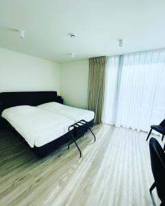 Krevet ili kreveti u jedinici u okviru objekta Hotel Bell-X Kortrijk-Wevelgem