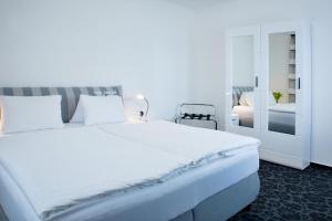 Łóżko lub łóżka w pokoju w obiekcie Parkhotel Plzen Congress Center