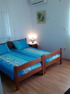 Postel nebo postele na pokoji v ubytování Apartments Vala