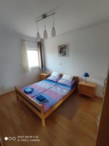 Postel nebo postele na pokoji v ubytování Apartments Vala
