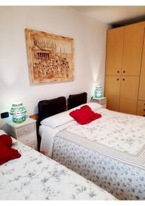 מיטה או מיטות בחדר ב-Appartamento Florivana