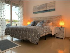 a bedroom with a large bed with a wooden headboard at Stunning 3 bedroom villa near Pinoso 