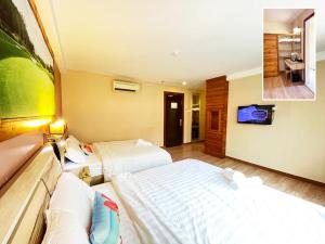 Postel nebo postele na pokoji v ubytování Hotel Balik Pulau