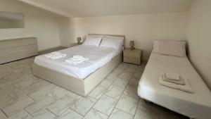 Postel nebo postele na pokoji v ubytování Casa del Minatore 1 - Gonnesa