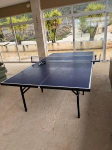 a ping pong table in front of a building at Stunning 3 bedroom rural apartment near Pinoso in Las Encebras