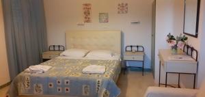 Katil atau katil-katil dalam bilik di Maria Apartments