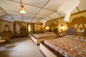 Postel nebo postele na pokoji v ubytování Amboseli Sopa Lodge + 26 fotografií