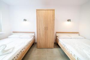 Posteľ alebo postele v izbe v ubytovaní Ryńska Widokówka