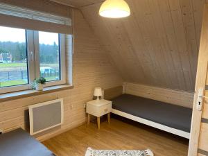 Posteľ alebo postele v izbe v ubytovaní Domek Całoroczny Fuleda -Mazury Giżycko Sauna Jacuzii Kominek