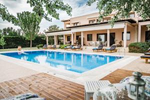 a swimming pool in the backyard of a house at Villa Belvedere in Alexandroupoli