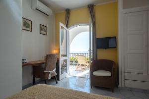TV a/nebo společenská místnost v ubytování Hotel Punta Scario