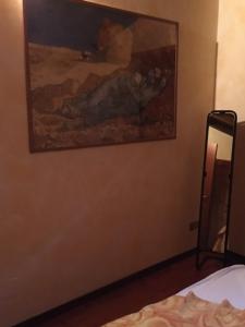 Televízia a/alebo spoločenská miestnosť v ubytovaní Villa Giardino Ulivo
