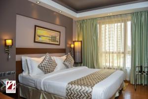 Voodi või voodid majutusasutuse Ngong Hills Hotel toas