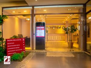 a lobby with a sign in front of a building at Ngong Hills Hotel in Nairobi