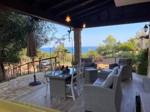a patio with a table and chairs and a view at Residenza I Ginepri in Domus de Maria