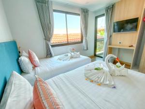 Postel nebo postele na pokoji v ubytování Baan Yuree Resort & Spa - SHA Plus + 37 fotografií