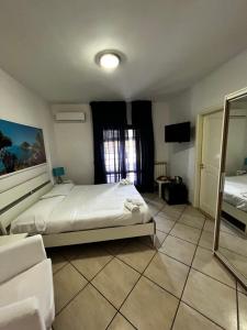 Postel nebo postele na pokoji v ubytování B&B Villa Nunzia