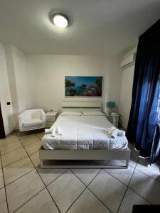 Postel nebo postele na pokoji v ubytování B&B Villa Nunzia