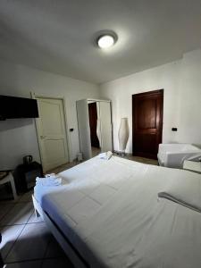Postel nebo postele na pokoji v ubytování B&B Villa Nunzia