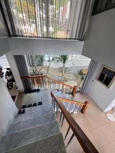 a staircase in a building with a glass ceiling at Nancy Grand Vung Tau Villa 5 in Xã Thang Tam