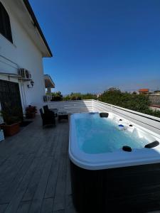 a hot tub sitting on the patio of a house at B&B Villa Nunzia in Ercolano