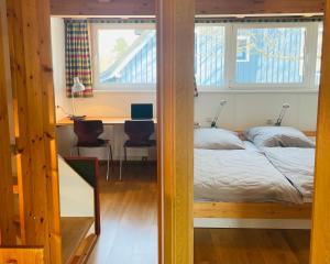 Postel nebo postele na pokoji v ubytování Austernfischer Prerow - Schönes Ferienhaus in Toplage mit großem Garten für Familie und Freunde