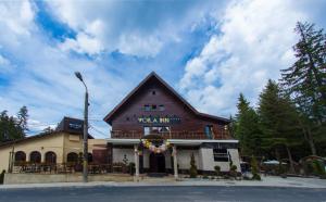 a building with a sign that reads volka inn at Voila Inn Predeal in Predeal