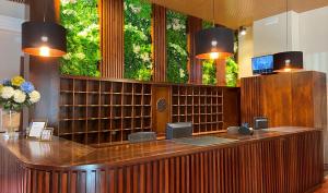 a bar in a library with a large window at Hotel Maria Cristina in Toledo