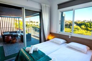 a bedroom with a bed and a large window at Luxury Marissa Villa in Chlorakas +27 photos
