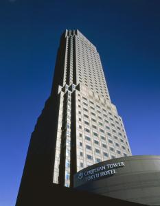 a tall white building with a sign in front of it at Cerulean Tower Tokyu Hotel, A Pan Pacific Partner Hotel in Tokyo