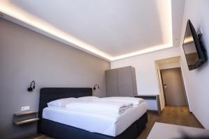 Giường trong phòng chung tại PARKHOTEL Krems