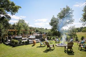 a group of chairs and a fire pit in a yard at Annamult Country House Estate in Kilkenny