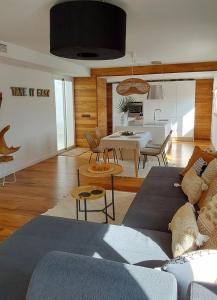 a living room with a couch and a table at Havana Penthouse in Cala Ratjada