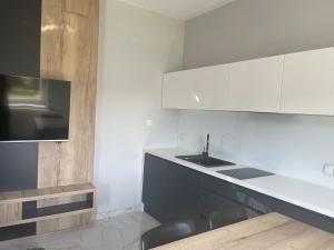 Kuchyň nebo kuchyňský kout v ubytování NOVA Apartamenty&Pokoje