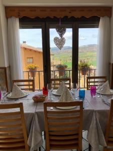 a table with a white tablecloth on a table with a view at Estudios Casa Lola de Talarn in Talarn
