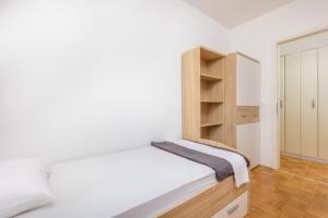 Posteľ alebo postele v izbe v ubytovaní Apartman Dokić 3