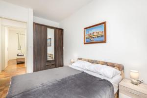 Posteľ alebo postele v izbe v ubytovaní Apartman Dokić 3