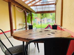 a wooden table and chairs in a room at Apartment Emil im EG mit Garten in Suhl in Suhl