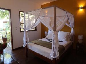 Ένα ή περισσότερα κρεβάτια σε δωμάτιο στο Anki Lodge