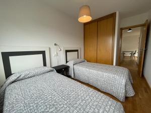 Postel nebo postele na pokoji v ubytování Apartamento Cristina