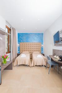 Un pat sau paturi într-o cameră la Hotel Repubblica