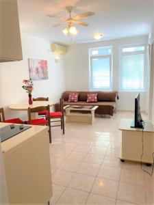 a living room with a couch and a table at Bliss Apartments in Budva