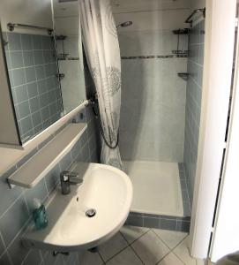 a bathroom with a sink and a shower at Bellevue B4 in Großenbrode