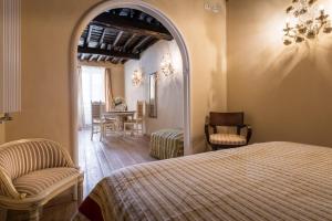 A bed or beds in a room at The Luxury Madonnina Suite