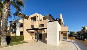 a building with stairs on the side of it at Janelas do Oceano - Casa de Ferias T3 Vilamoura in Vilamoura